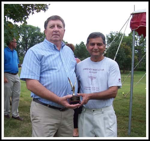 Dr. Mody presenting Don Wyatt and Star*Tel Systems, Inc., the 2010 Volunteer of the Year award